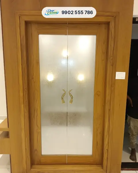 Teak puja room door with frosted glass and brass peacock handles