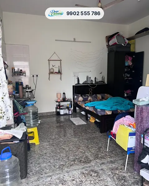 Lived-in 1 RK studio with bed, wardrobe and kitchenette before cleaning