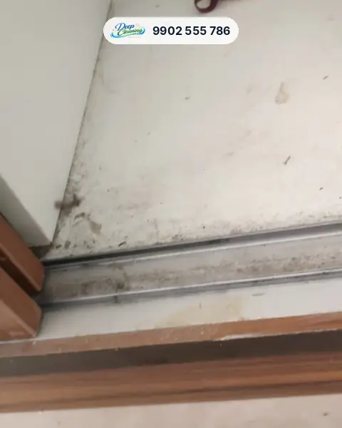 Dusty sliding wardrobe track and floor with debris